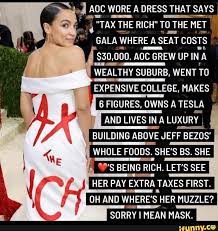 AOC AA WORE A DRESS THAT SAYS TAX THE THE RICH TO THE MET GALA WHERE