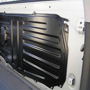 Behind rear seat