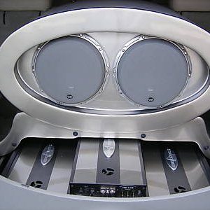 Motorized amplifier rack and subwoofer display