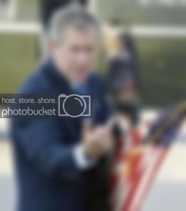 george-bush-middle-finger-264x300.jpg