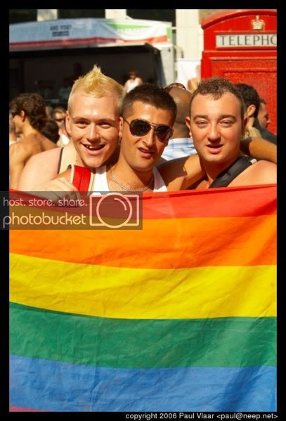 407px-RainbowFlagPosersEuroprideLondon2006.jpg